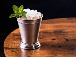 rterior studio west hollywood mint julep cocktails in metal tumbler on a wood table